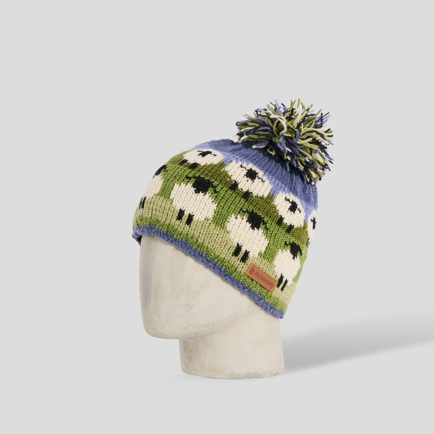 Cuffia pecorelle lana pom pom verde Pachamama