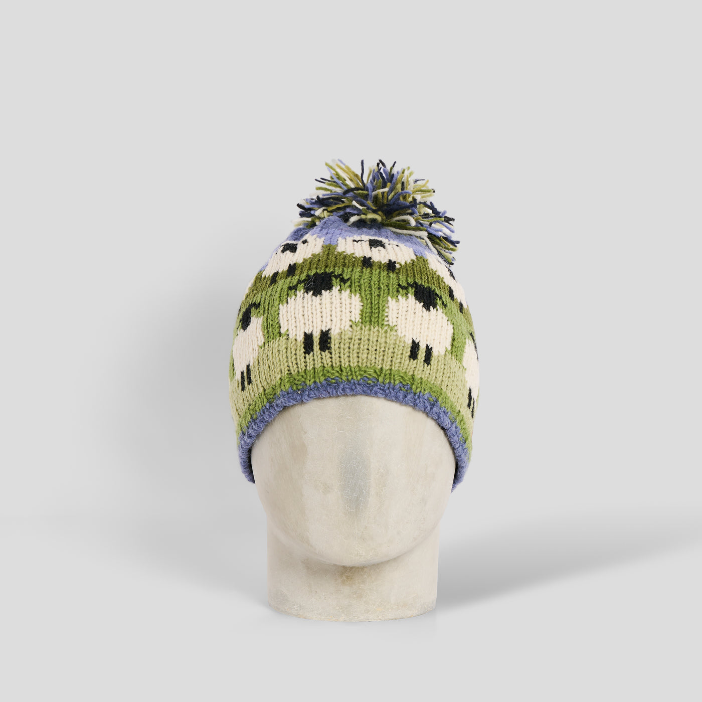 Cuffia pecorelle lana pom pom verde Pachamama